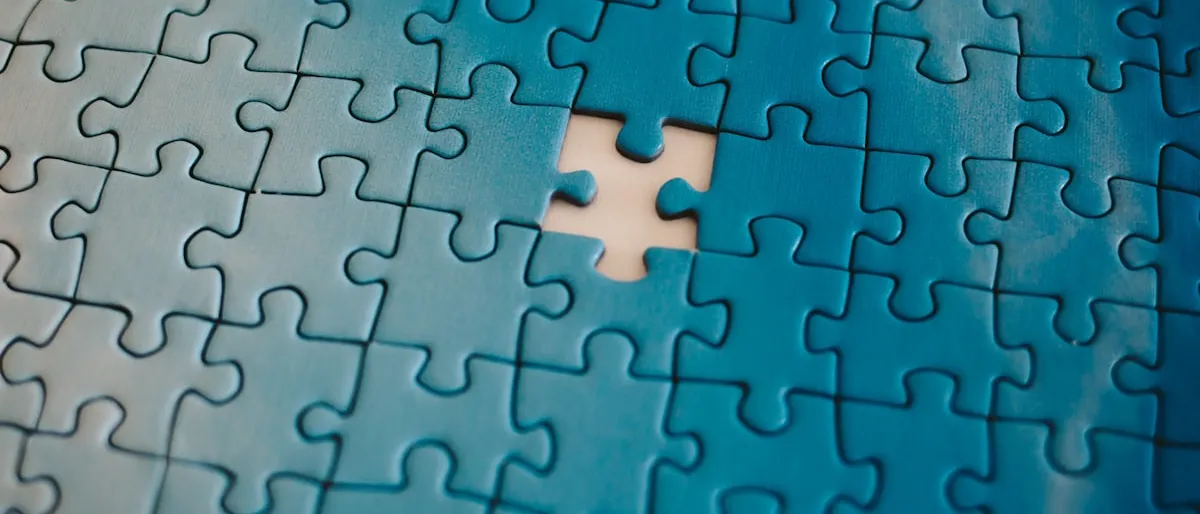 A blue jigsaw puzzle with one piece missing from the middle