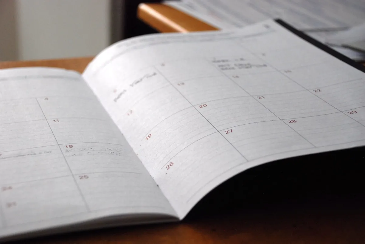 A monthly planner open on a desk
